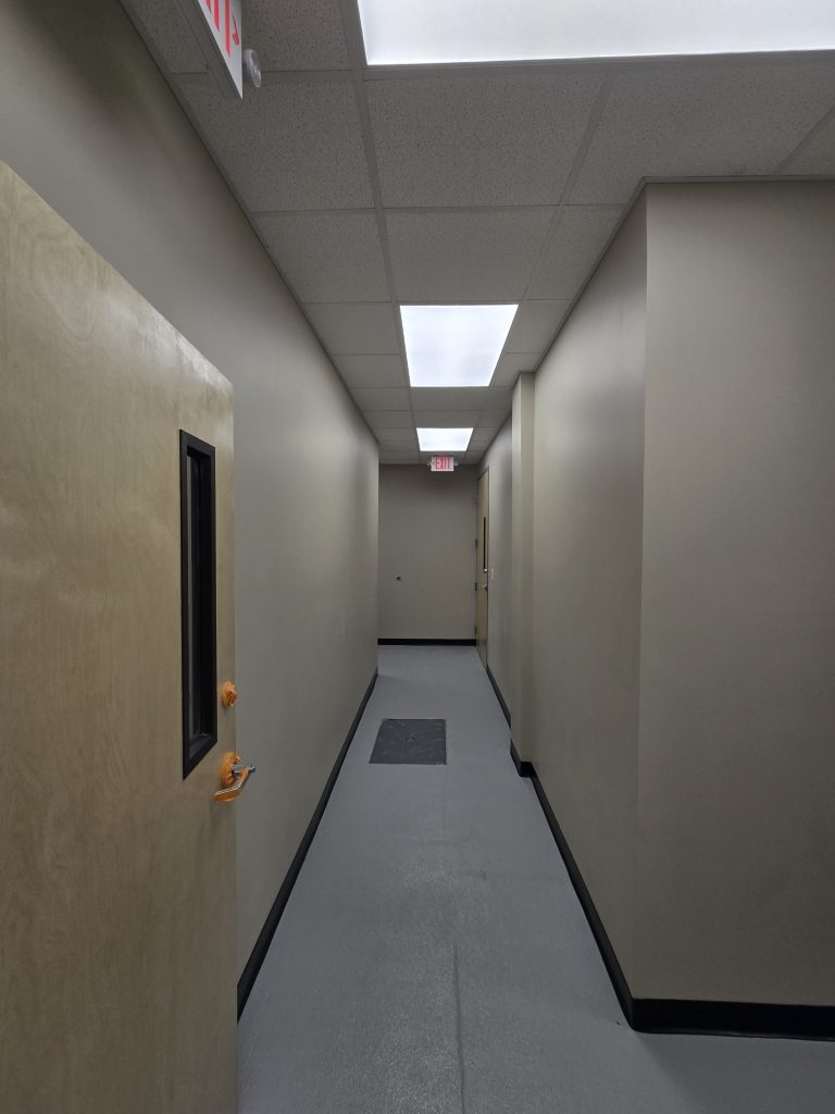 Common Area Hallway. Grease Trap in floor